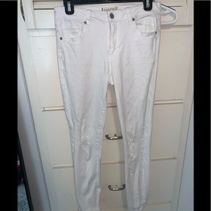 WHITE JEANS. HOLES IN THEM